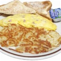 Ham Cheese Omelet · A fluffy omelet with ham, cheddar cheese and side of hashbrowns.