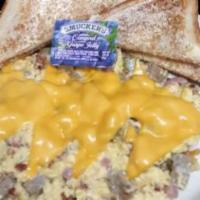 Meat Lover'S Skillet · Scrambled eggs loaded with ham, bacon, sausage, green peppers, onions, over hashbrowns, and ...