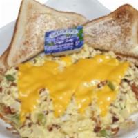 Bacon Scrambler · Eggs scrambled with bacon, green peppers, and onions, then topped with melted American cheese.