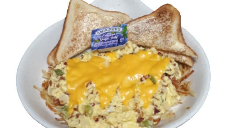 Bacon Scrambler · Eggs scrambled with bacon, green peppers, onions, and topped with melted American cheese. Served with hashbrowns.