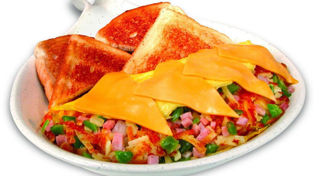 The Skillet Omelet · An omelet stuffed with hashbrowns, ham, green peppers and onions, then topped with American cheese.