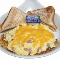 Ham Scrambler · Eggs scrambled with ham and topped with melted American cheese. Served with hashbrowns.