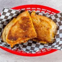 Ultimate Grilled Cheese · Sourdough bread, parmesan spread, gruyere and cheddar.