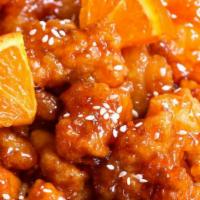 Orange Chicken · Lightly battered chicken chunks and hot chili peppers, garnish with steamed broccoli and can...