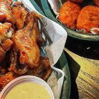 12 Wings · Choice of boneless or bone-in. tossed in your choice of our homemade signature sauces. serve...