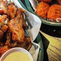6 Wings · Choice of boneless or bone-in. tossed in your choice of our homemade signature sauces. serve...