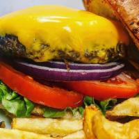 Pub Burger · 1/2 lb patty, American cheese, lettuce tomato, onion, brioche bun.