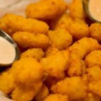 Wisconsin Cheese Curds · Jake's peppercorn dipping sauce.