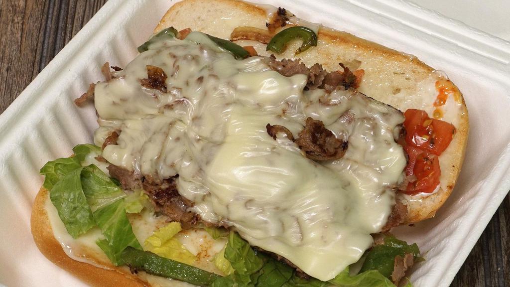 Philly Cheesesteak · Thinly sliced steak, Swiss cheese, grilled onions, grilled green peppers, mayo, tomatoes, lettuce.