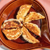 Pot Stickers (6 Pcs) · Seared dumplings filled with ground chicken and vegetables, served with hot sauce and ginger...