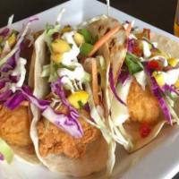 Crispy Battered Fish Tacos · Topped with asian cabbage, citrus aioli & mango salsa