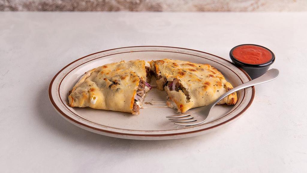 Meat Calzone · Mozzarella, Genoa Salami, Pepperoni, Roasted Red Peppers, Green Olives