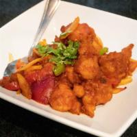 Gobi Manchurian · Gluten free, vegan. Chickpea batter-fried cauliflower sautéed with bell pepper and onions an...