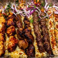 Rayan Mixed Grill · Three skewers of our most popular natural wood mesquite-grilled kababs (shish kabab, kuftah ...