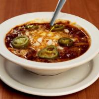 Cowboy Chili · Served with cheddar cheese and onion. Add jalapenos if'ya dare.