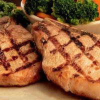 Cowboy Chops · Thick and juicy bone-in pork chops.  Choose from double or single.