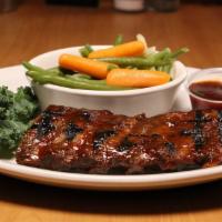Fall-Off-The-Bone Baby Back Bbq Ribs (Half Slab) · Baby back ribs slow roasted and caramelized on the grill with our signature BBQ sauce.