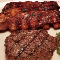 Baby Back Bbq Ribs And Top Sirloin · 6 oz. top sirloin steak and a 1/2 slab of our baby back BBQ ribs.