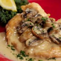 Texas Corral Chicken · 10 oz. chicken breast lightly breaded and sautéed with mushrooms and fresh lemon, in a cream...