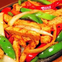 Steak Fajitas · Marinated strips of steak with grilled peppers and onions.