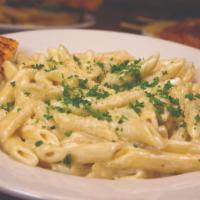 Pasta Alfredo · Al dente penne pasta prepared with our creamy Parmesan sauce and served with garlic bread.