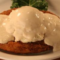 Country Fried Steak · Hand-breaded and fried 12 oz. chopped steak served with our homemade mashed potatoes and cov...