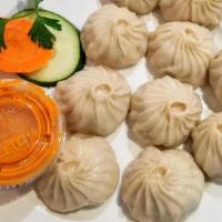 Steamed Momo · Minced Vegetable or Chicken or Paneer or Mutton or Fish mixed in Himalayan spices, stuffed i...