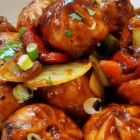 Chili Momo · Momo sauteed with onion, bell pepper, red chili, and Hot Sweet Sichuan pepper. Chicken OR Ve...
