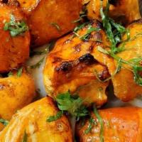 Chicken Tikka · Grilled Chicken with a blend of aromatic herbs and spices.