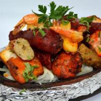 Himalayan Mixed Tandoori Grill · Tandoori chicken, chicken tikka, chicken shish kebab, lamb shish kebab, fish tikka, and shri...