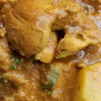 Chicken Vindaloo · Chicken and potato cooked in Goan style tangy hot curry sauce. Served with side basmati rice.