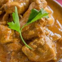 Chicken Curry · Chicken simmered in onion and tomato sauce with a blend of aromatic spices. Served with side...