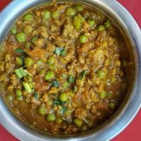 Keema Mutter · Minced lamb with green peas cooked in traditional Indian spices, tomato, and onion sauce. Se...