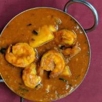 Shrimp Vindaloo · Shrimp and potatoes cooked in hot and tangy goa-style curry sauce. Served with side basmati ...