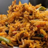 Vegetable Biryani · Basmati rice is flavored with mixed vegetables and cooked in the chef’s special biryani masa...