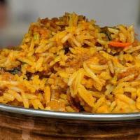Goat Biryani · Basmati rice is flavored with Goat Meat and cooked in the chef’s special biryani masala. Ser...