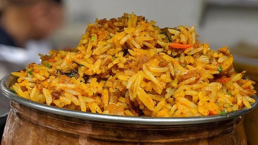 Lamb Biryani · Basmati rice is flavored with Lamb and cooked in the chef’s special biryani masala. Served with Raita.