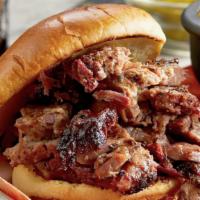 Texas Beef Brisket Sandwich · Piled high with hand-seasoned hickory-smoked Texas Beef Brisket.
Served with choice of 1 sid...