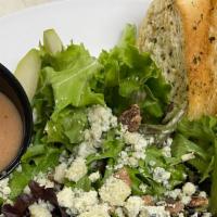 Fresh Pear & Gorgonzola Cheese · Fresh pears, gorgonzola cheese and candied pecans over a bed of spring greens with pear vina...