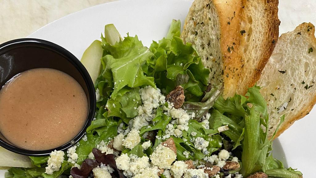 Fresh Pear & Gorgonzola Cheese · Fresh pears, gorgonzola cheese and candied pecans over a bed of spring greens with pear vinaigrette.