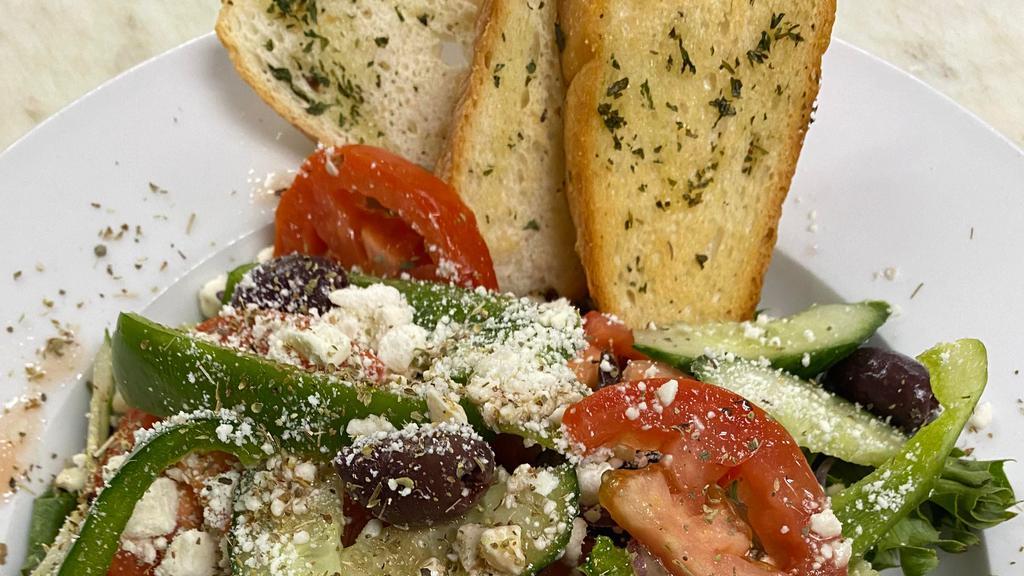 Mediterranean Greek Salad · Spring greens, tomato, cucumber, green peppers, feta cheese, kalamata olives, onions, oregano, extra virgin olive oil and red wine vinegar.