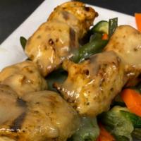 Italian Skewers · Served with garlic bread and a house salad.  Italian herb marinated skewers of chicken or sh...