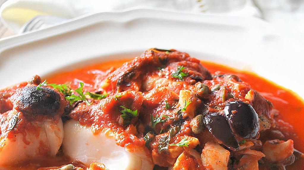 Sicilian Cod · baked in tomato sauce with olives  served with rice and vegetables