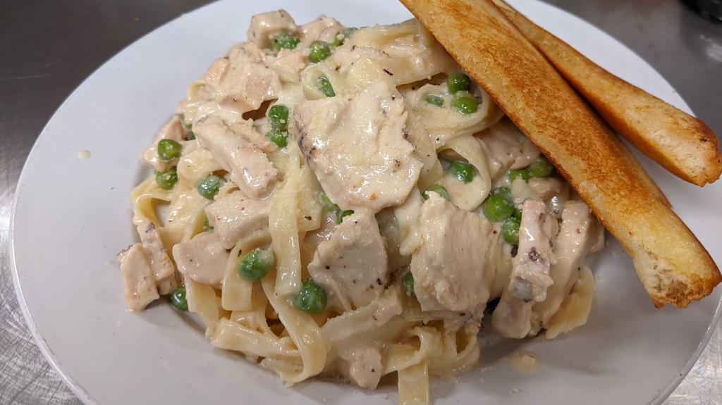 Giorgio'S Chicken Fettucine Alfredo · Our homemade Alfredo sauce, which combines simple ingredients like butter, cream and Parmesan cheese , is lightly tossed with sauteed mushrooms, peas and sliced tender grilled chicken breast.