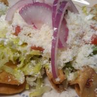 Flautas · Four handmade corn tortillas filled with cheese or chicken topped with lettuce, tomatoes, cr...