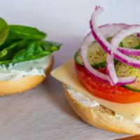 The Veggie Swiss · Swiss Cheese, tomato, red onion, cucumber, and spinach with green onion cream cheese.