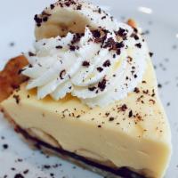 Slice Of Black Bottom Banana Cream · chocolate ganache, bananas, vanilla pastry cream, whipped cream, shaved chocolate