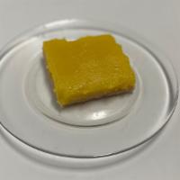 Lemon Bar · Classic lemon bars featuring a soft butter shortbread crust and a tangy sweet lemon curd fil...