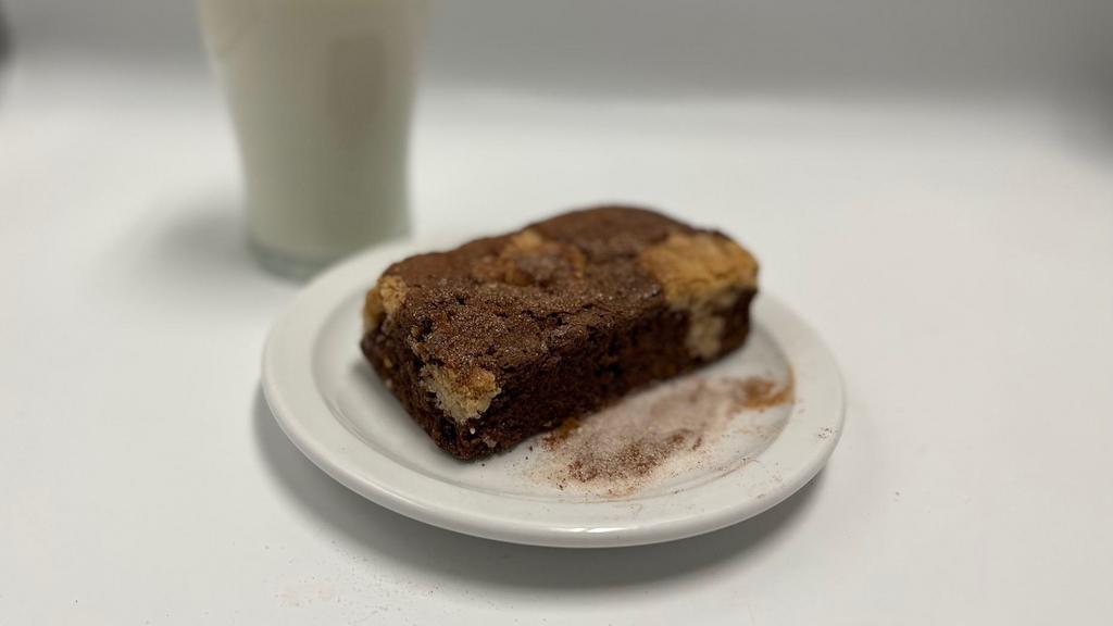 Snickerdoodle Brookie · Dark chocolate brownie topped snickerdoodle cookies and dusted with cinnamon and sugar.