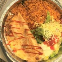 Quesadilla Rellena · A flour tortilla grilled and stuffed with cheese, chopped beef, and refried beans. Served wi...